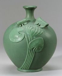 Art Pottery Matte Green Glazed Water Lily Vessel, Ohio, c. 1910, flared rim with short neck on bulbous molded body with water lily in h